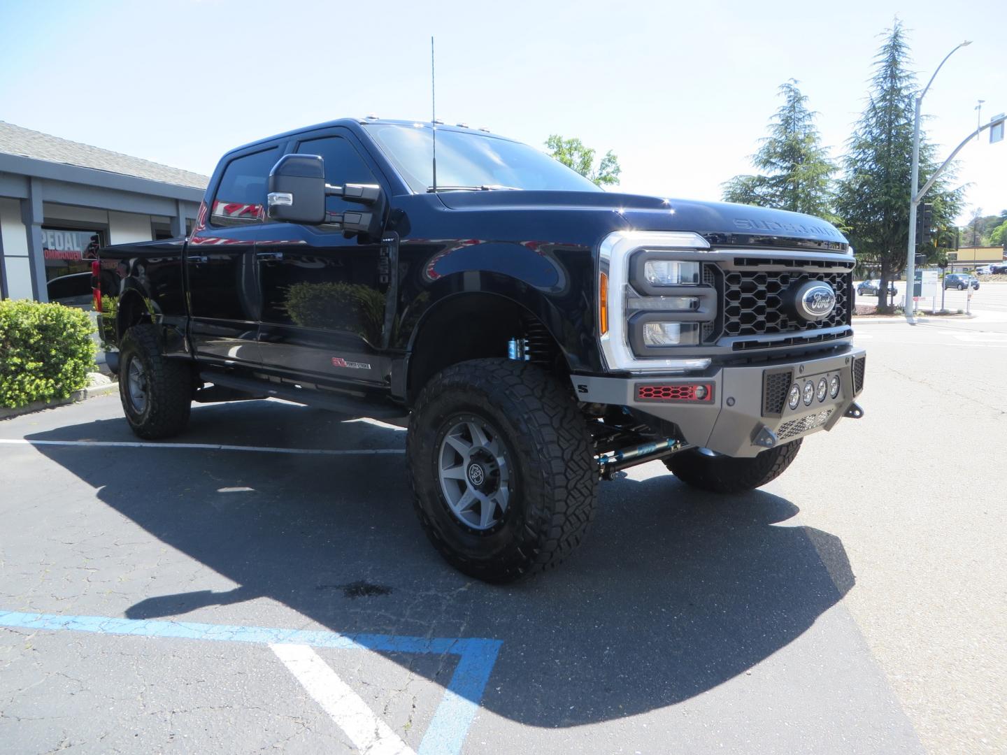 2023 BLUE /BLACK Ford F-350 SD Lariat Crew Cab Long Bed 4WD (1FT8W3BM9PE) with an 6.7L V8 OHV 16V DIESEL engine, 6A transmission, located at 2630 Grass Valley Highway, Auburn, CA, 95603, (530) 508-5100, 38.937893, -121.095482 - Sinister Diesel Built 23 Lariat Superduty with a ton of extras....... Sinister custom radius arms and traction bars, King Offroad shocks & Steering stabilizers, 18" Icon Rebound wheels, 37" Nitto Recon Grappler tires, Cat Back Exhaust, PMF rear leaf Springs, Sinister Front and Rear bumpers, Rigid Li - Photo#2